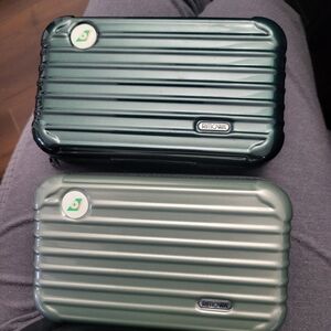 Two Green Rimowa Accessory Case
